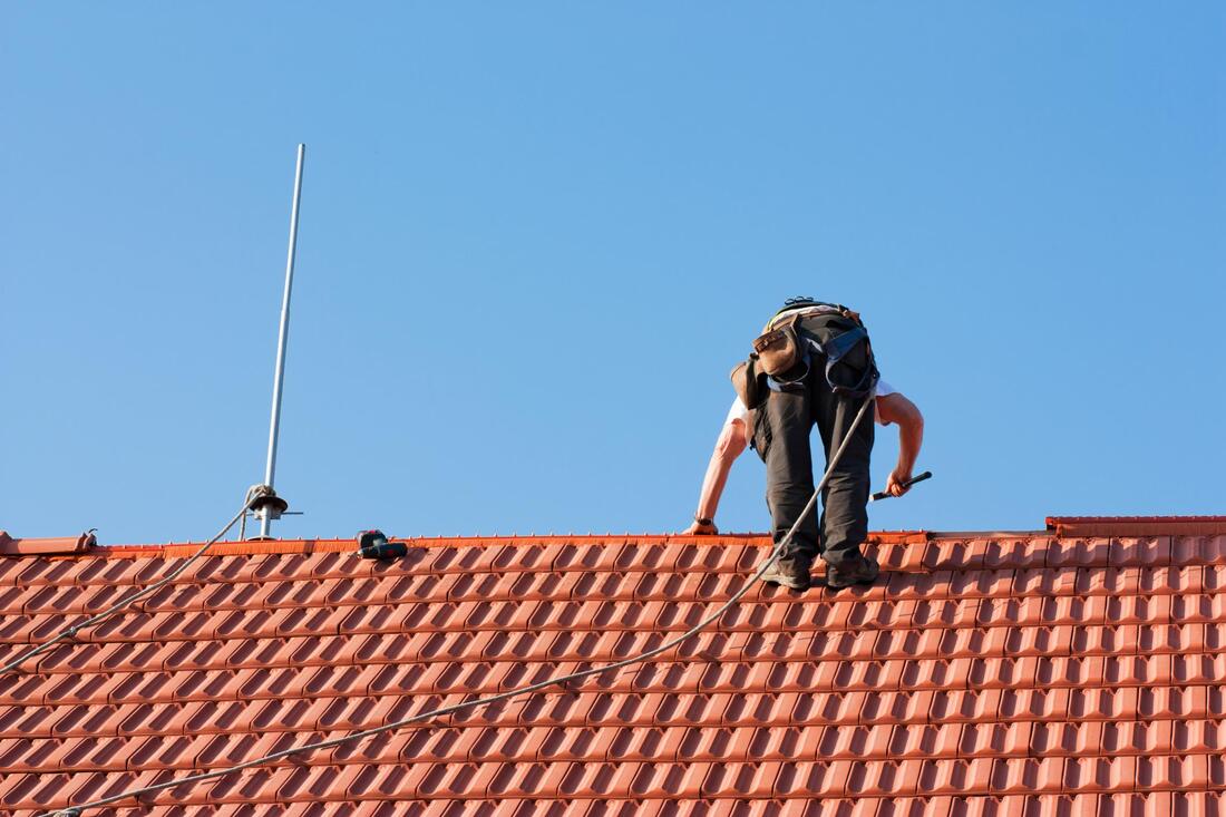man on the top of the roof